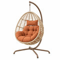 Poltrona sospesa 105 x 105 x 195 cm in fibra intrecciata beige con seduta terracotta stile boho